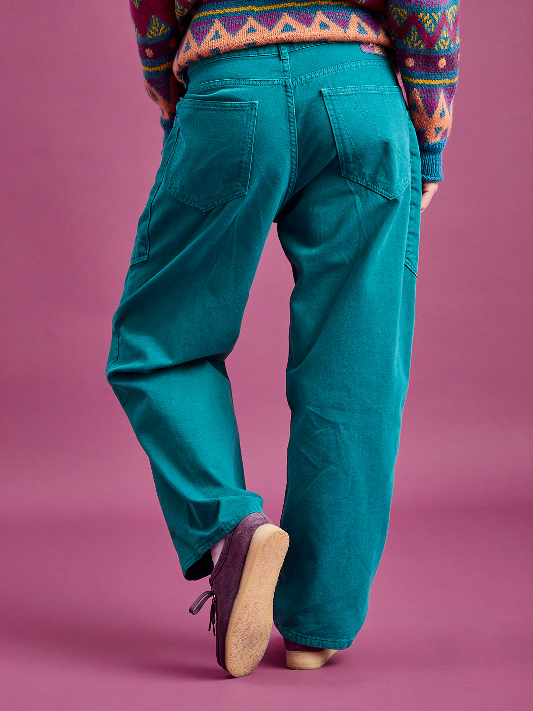 Back shot of the unisex Asani trousers, featuring two back pockets