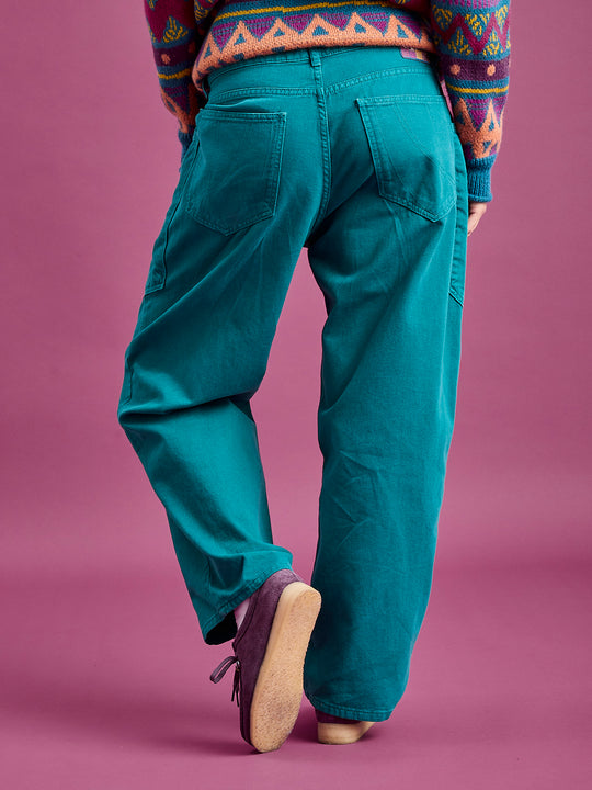 Back shot of the unisex Asani trousers, featuring two back pockets