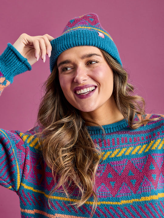 This woolly hat features a unique design that adds a touch of personality to your cold-weather outfits.