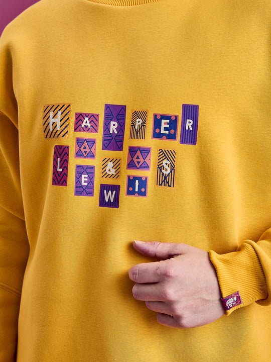 Detail shot of the striking Harper & Lewis branded graphic and the woven tab on the cuff.