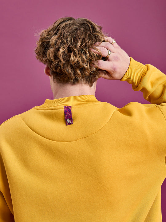 Close up shot of the branded woven back neck tab, which can be used as a hanging loop.