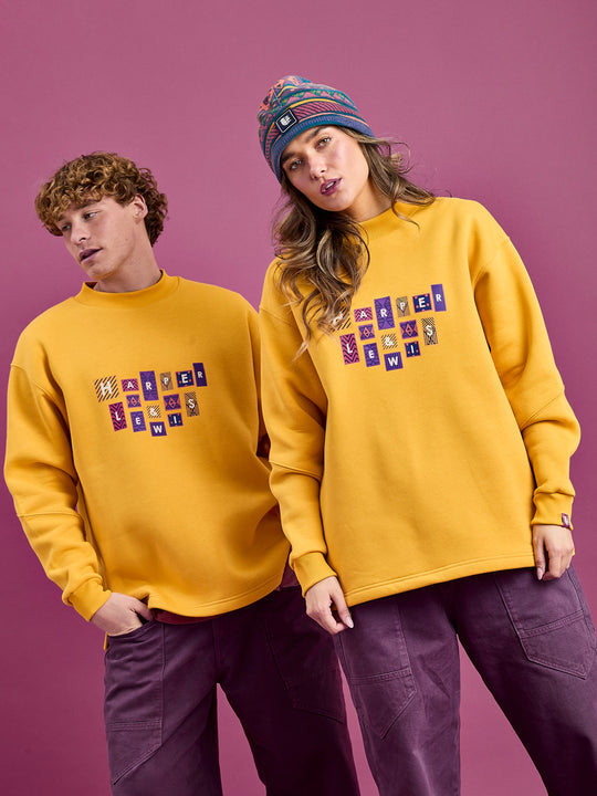 Both Models wearing the Winnie Sweater in Musard.