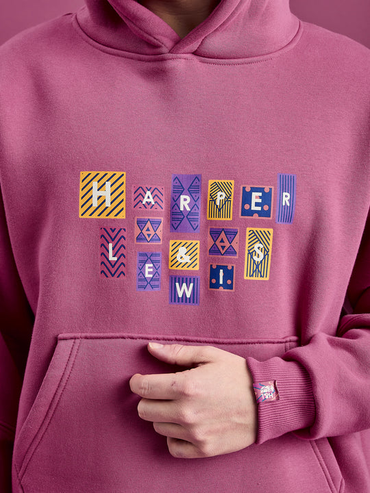 Details of the Garnet Hoodie, with the printed logo on the front and sleeve detail.