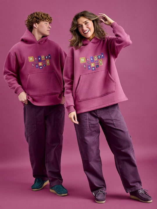 Both models wearing the hoodie showing the large kangaroo pocket.