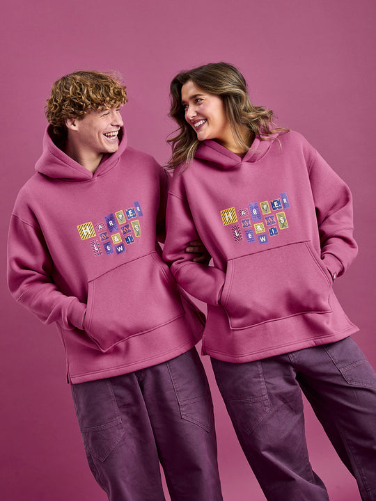 Both models wearing the Garnet Hoodie showcasing the soft finish.
