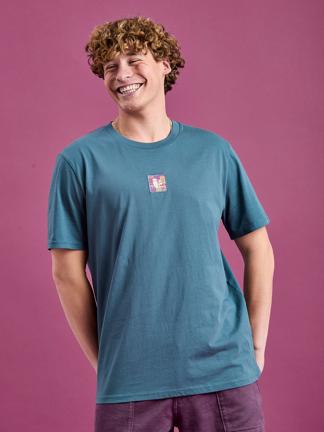 Male Model wearing the Petrol T-shirt with a front logo and sleeve details
