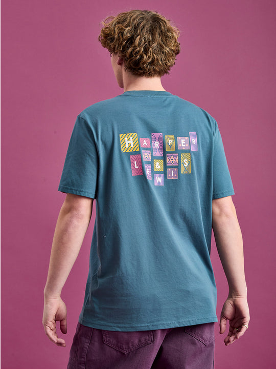 Male Model wearing the Petrol blue t-shirt with aztec print