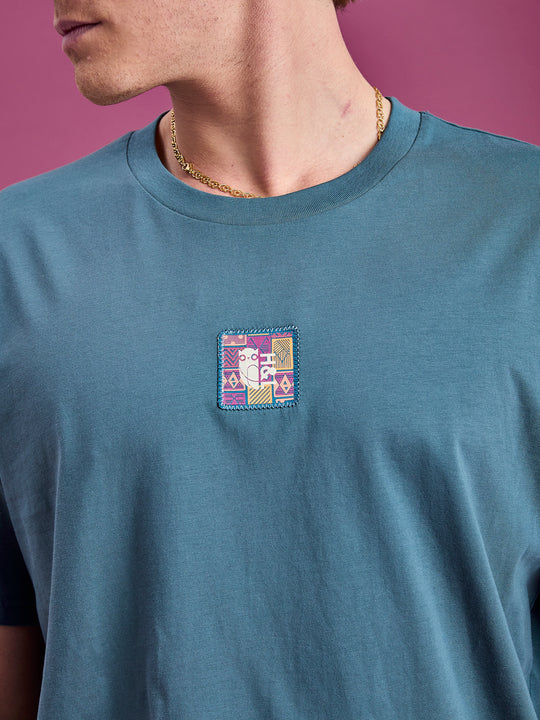detail shot of the branded aztec badge in this seasons colours
