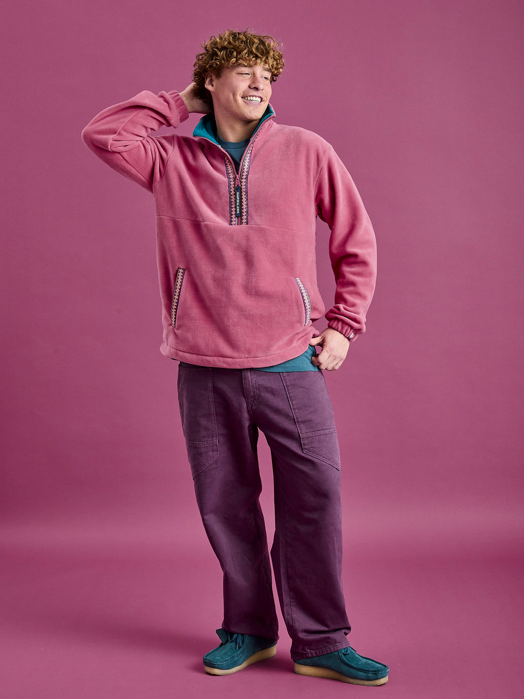 Male Model wearing the Dark Rose Fleece, showcasing the movement of fleece.