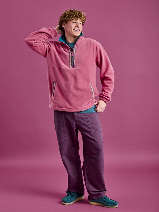 Male Model wearing the Dark Rose Fleece, showcasing the movement of fleece.