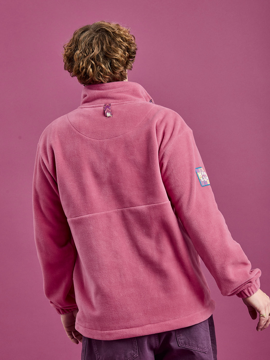 Back shot of the fleece jacket, showcasing the new branded patch on the back neck.