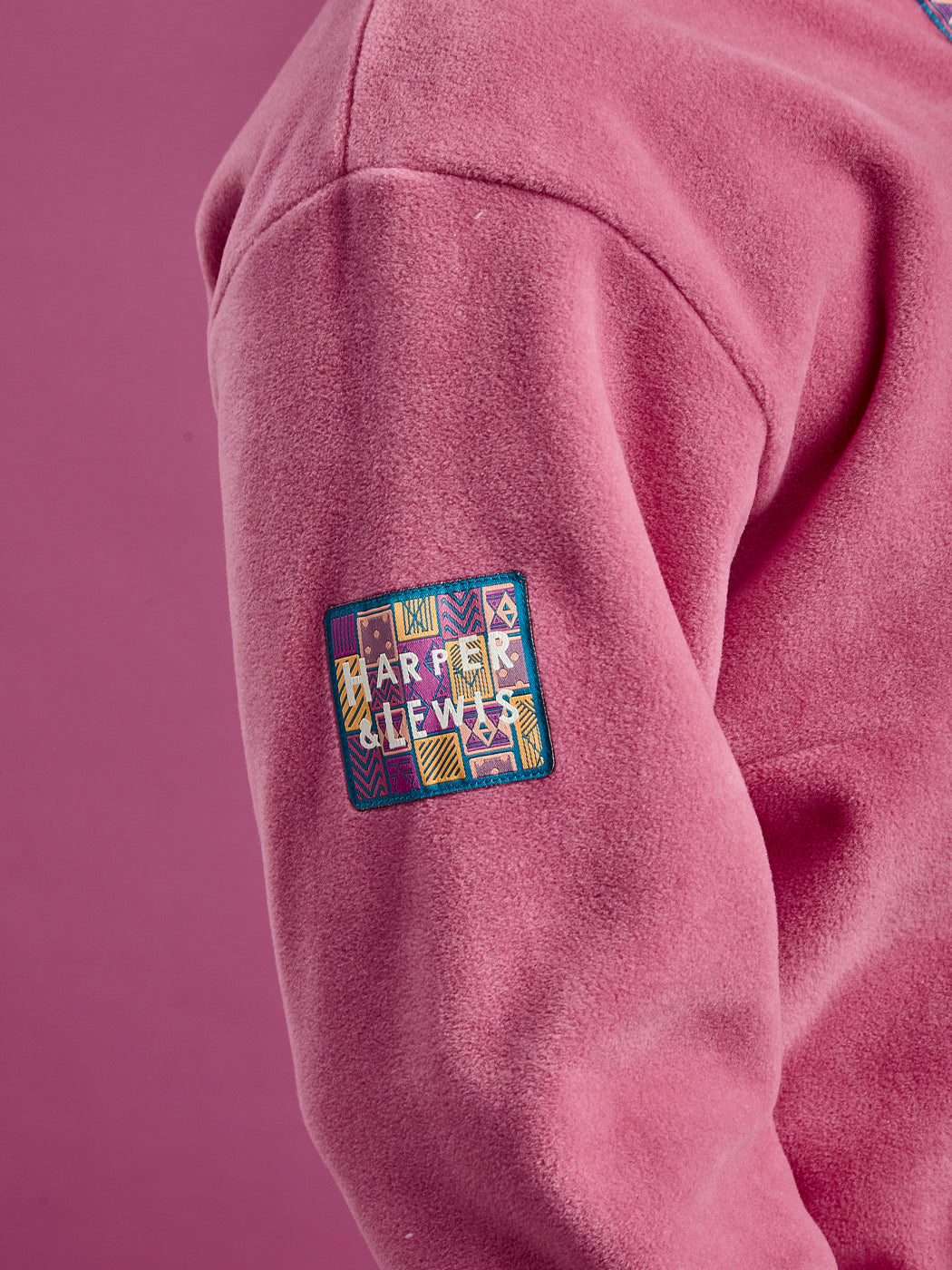 Detailed shot of the sleeve patch, in an aztec pattern with our 'Harper & Lewis' branding.