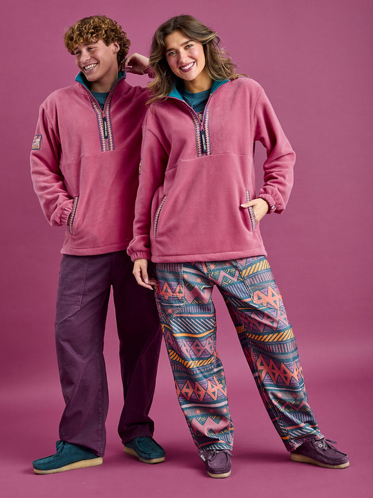 Both models wearing the Bronwyn Fleece in Dark Rose with Aztec Wave Pattern woven tape at placket and pockets.