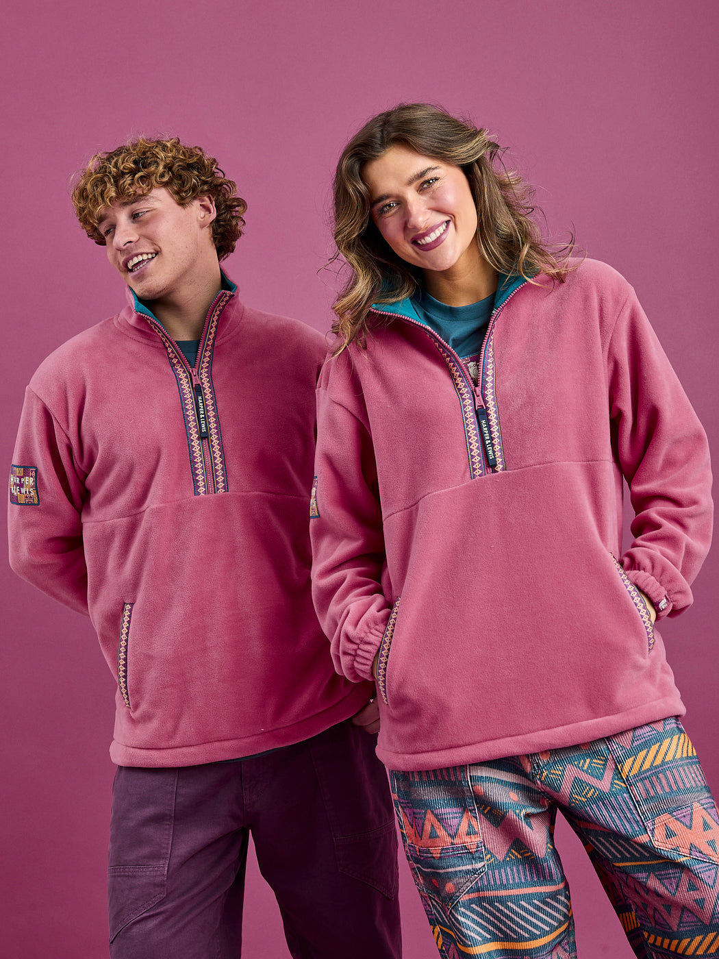 Model males wears a Size Large and female model wears size Medium in the Dark Rose Bronwyn Fleece Jacket.
