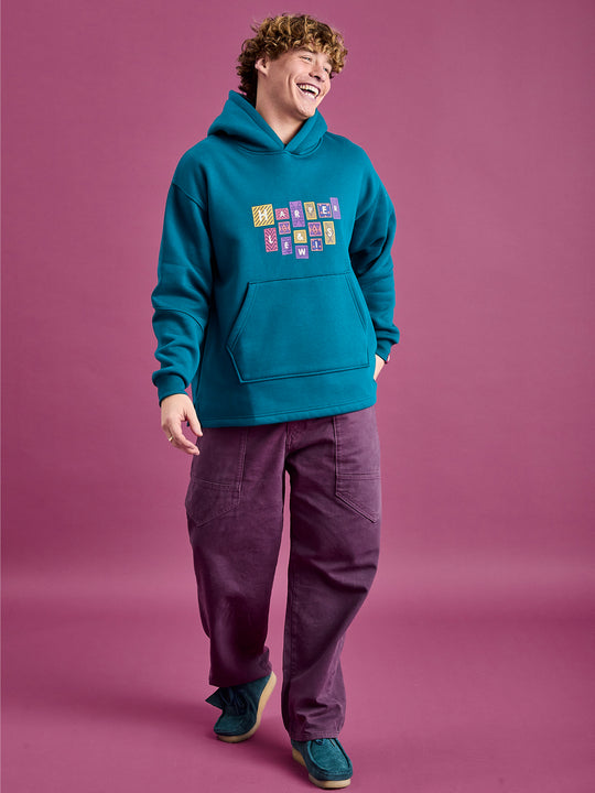 Male models wearing the oversized hoodie with the released hem.
