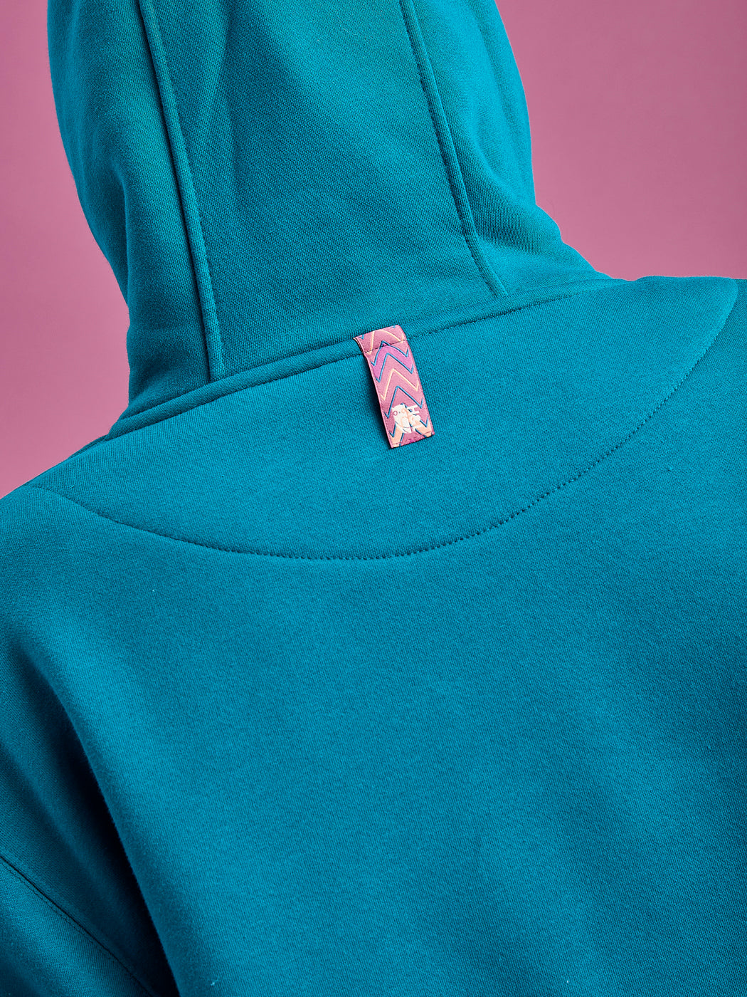 Detail shot of the back neck tab, in our signature print of the season.