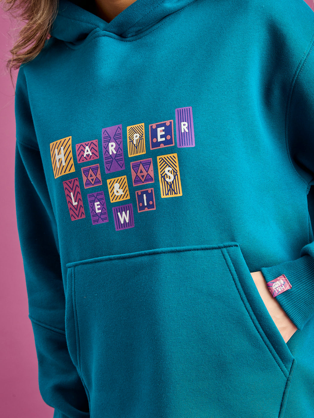 Detailed shot of the front graphic and tab on the sleeve.