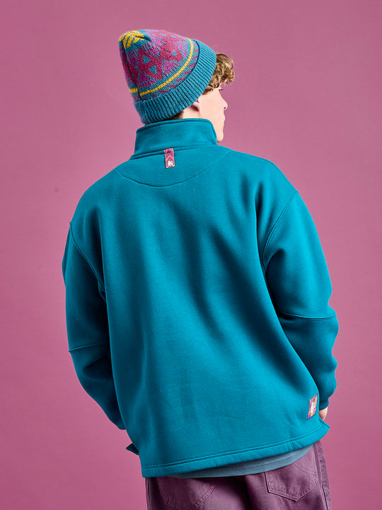 Back shot of the fable 1/4 zip sweat, features a yoke detail and a tab detail on the back neck that can be used as a hanging loop also.