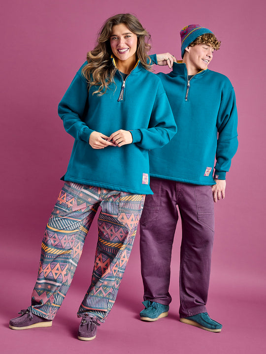 Both Models wear the Fable 1/4 Zip sweater in Teal 
