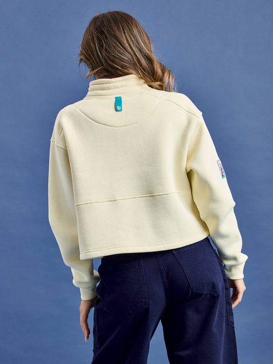 Made from a brush back fleece material, the sweater is composed of 65% cotton and 35% polyester, ensuring durability and warmth.
