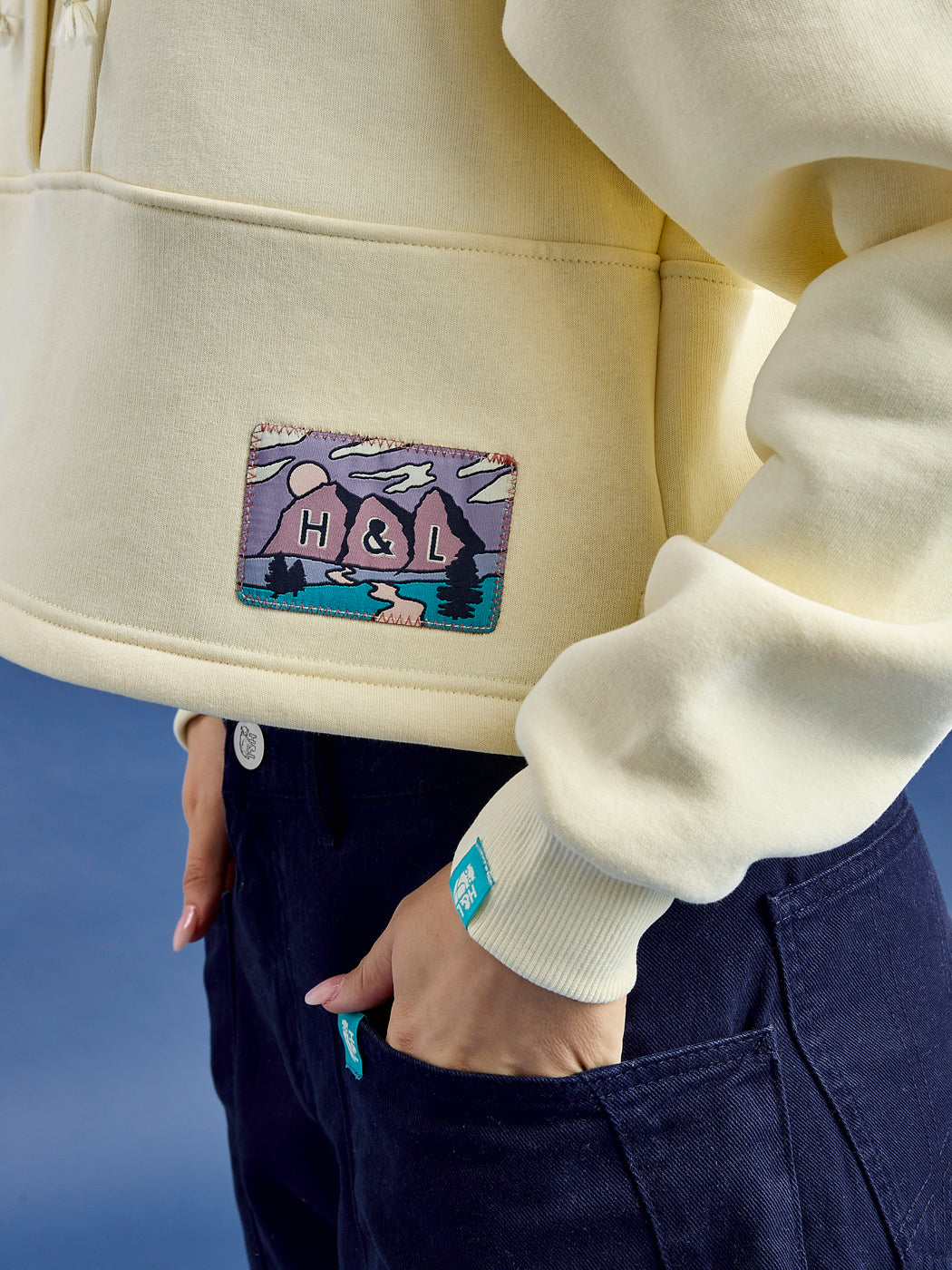 The butter sweater is composed of 65% cotton and 35% polyester, ensuring durability and warmth.