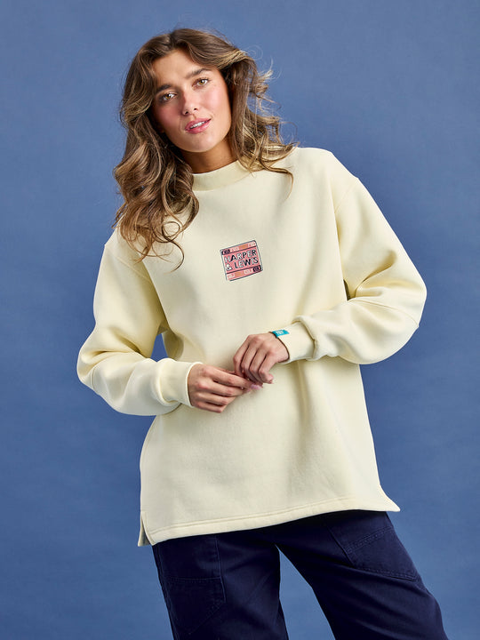 Female model wears Atlas sweatshirt made from fleece-back jersey fabric composed of 65% Cotton and 35% Polyester.