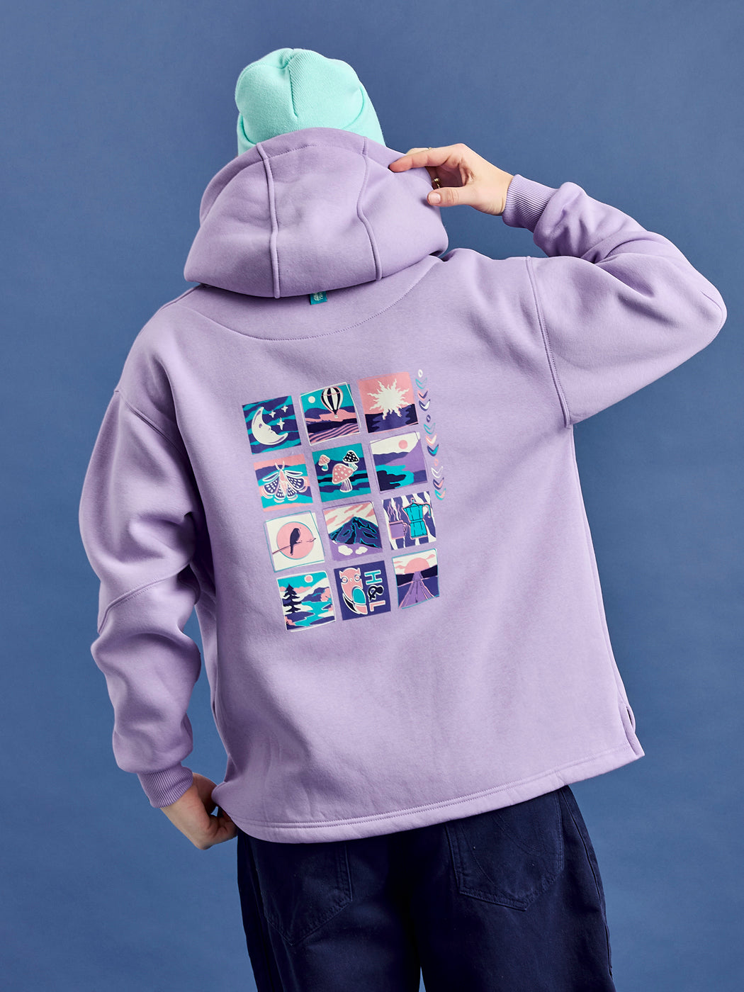 The Lavender purple oversized hoodie features a mountain wave inspired graphic.