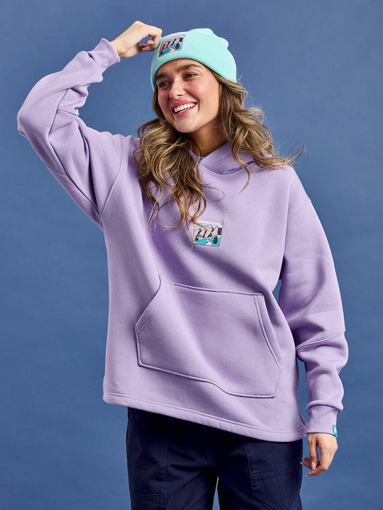 Female Model wearing the Ellerie hooded pullover featuring a oversized fit with set-in sleeves.