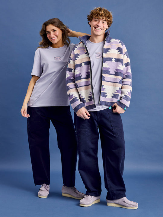Both models wearing the unisex fit tee in a muted purple colour