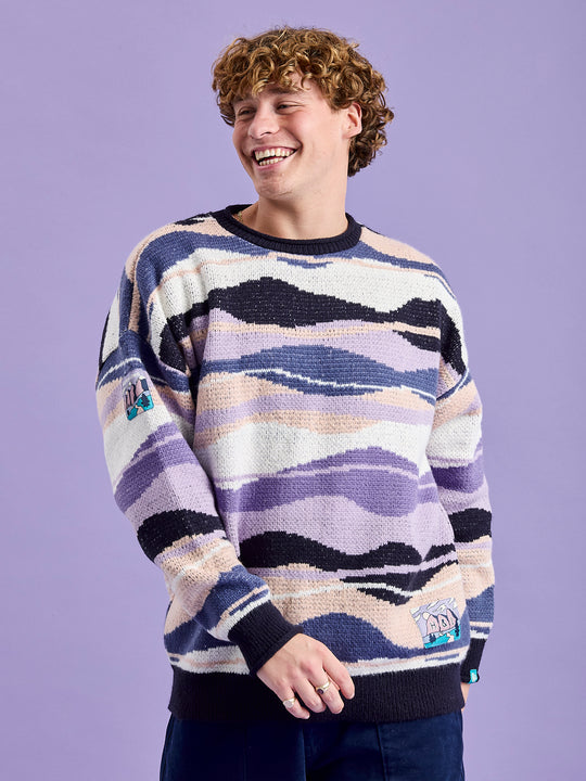 Male Model wearing the knitted jumper made from 75% Acrylic, 25% Nylon for durability and softness.