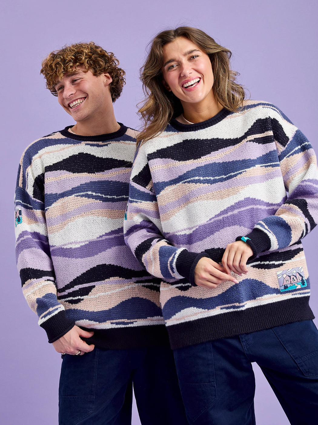 Both Models wearing the Dana Retro Pattern Knitted Jumper.