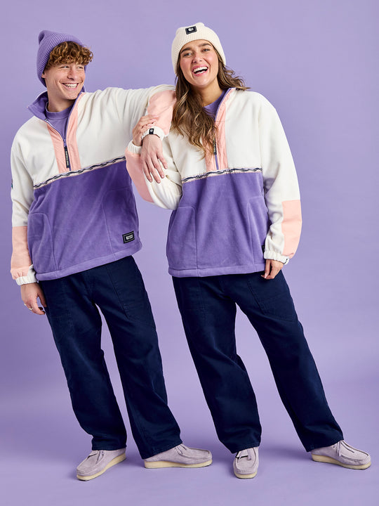 Both Models wear the Tory half zip fleece with a light peach crinkle placket by the zip and on the bottoms of the sleeves.