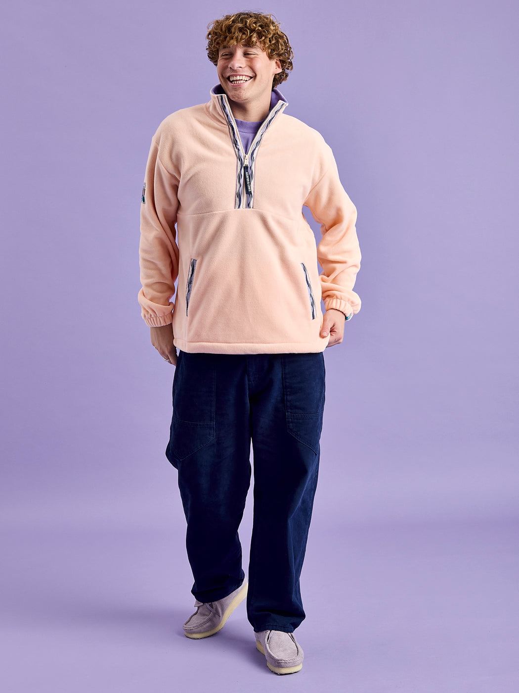 Male Model is wearing the Fleece Jacket with Elasticated cuffs and patterned adjustable shockcord at hem.