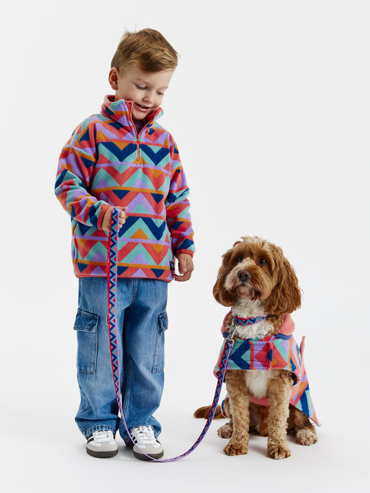 Keep your furry friend warm and stylish with the Raver Dogs Fleece.