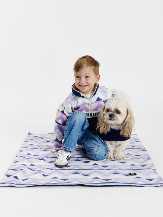 Contrasting Navy fold over collar, with cream piping on this dogs fleece coat.