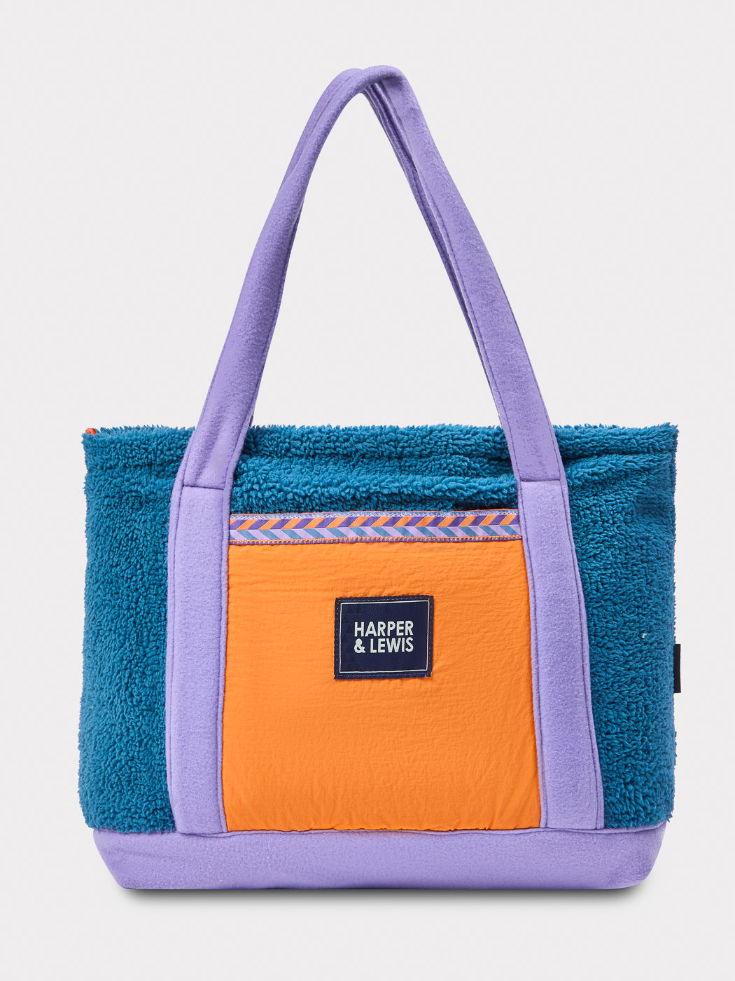 Crafted from soft sherpa fleece, this bag combines functionality with a unique, standout aesthetic.