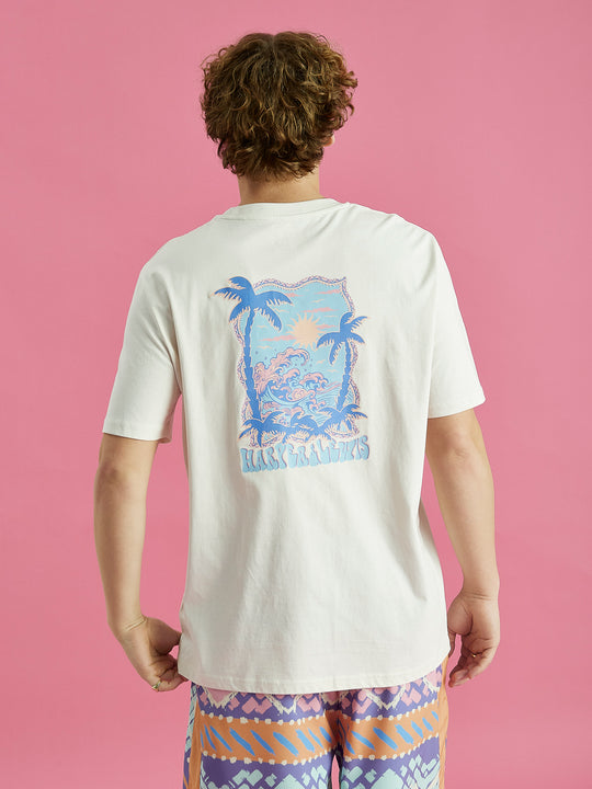 The colour of this Alwan tee is a cream colour similar to a beige.