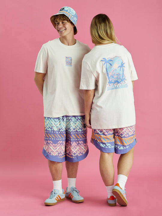 The Oversized cream t-shirt features the tropical graphic on the front and the back of the tee.