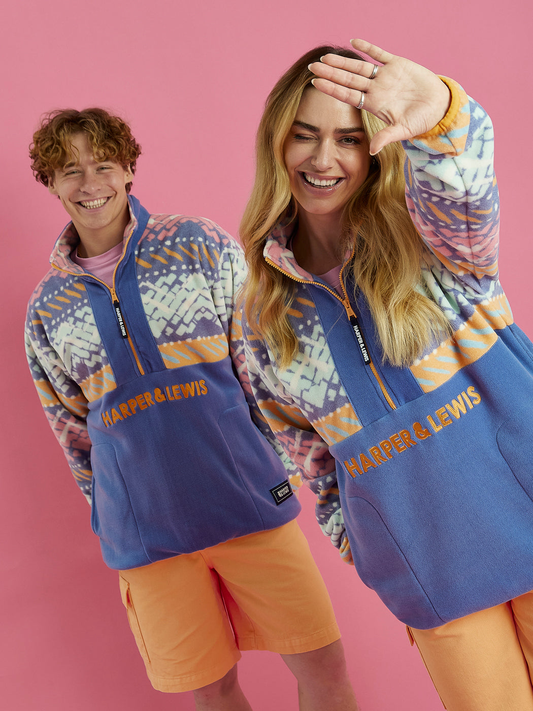 Both Models wearing the Bodie fleece, The fleece features the new Festival Print.