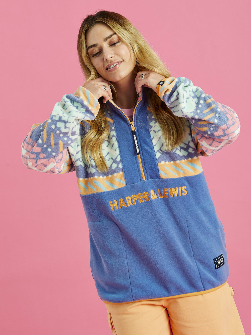 Female Model wearing The Bodie Mountain Pattern Fleece, which is made from 100% Polyester.