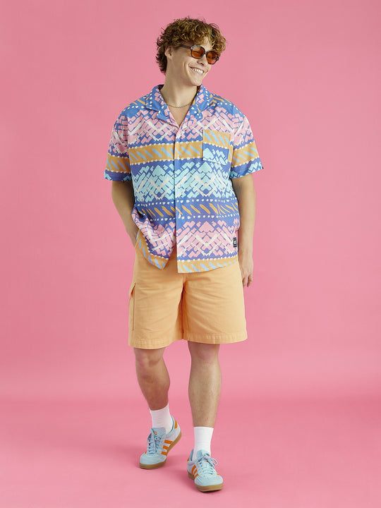 Full length image of a male model wearing the shirt, this shirt features a front pocket on the left chest.