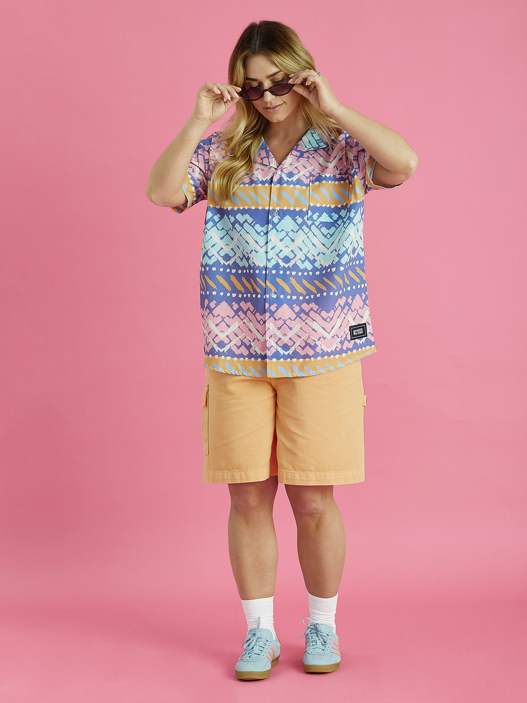 The reef shirt features colours of Apricot, Airforce, Mint, Pink, Cornflower Blue & Cream.
