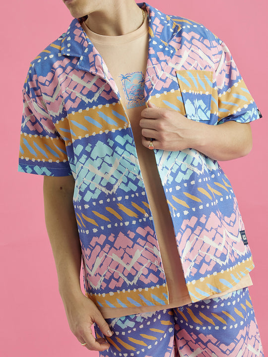 This is the Cove Shirt, styled as on open shirt with a t-shirt underneath, made from 100% Viscose.