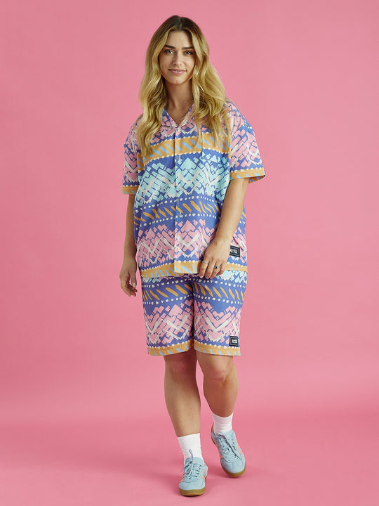 Female model wears the Cove shorts with matching shirt, the shorts feature a elasticated waistband with a drawcord, ensuring a perfect fit.