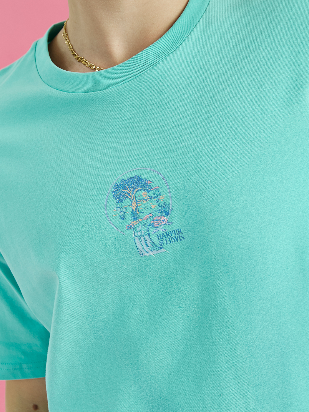 Front detail shot of the mint Aura tee, this shows the graphic which is the tree of life in blue, lavender and peach.
