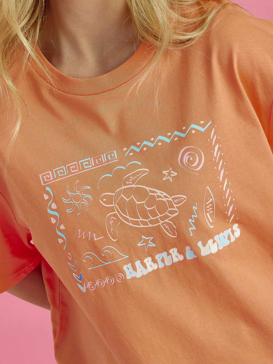 Detailed shot of the graphic, which is a sea theme with a turtle and Harper & Lewis branding.