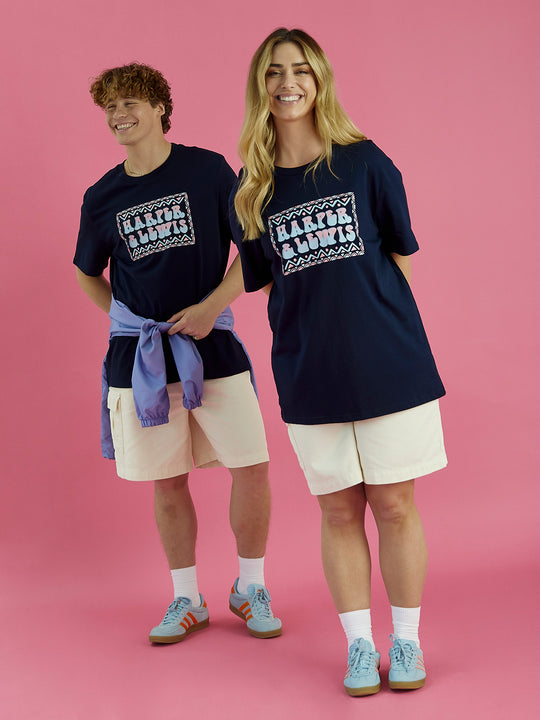 Male & Female Model both wearing the Taran t-shirt in Navy, this tee features an abstract H&L spell out design.