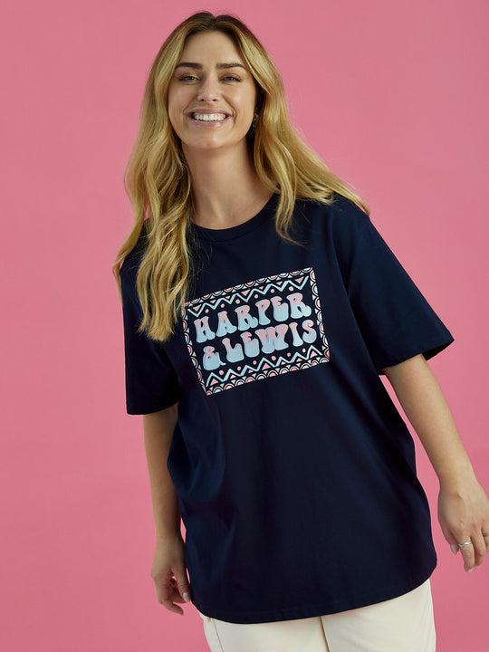 Female Model wearing the Taran t-shirt in navy, this tshirt has a relaxed fit.