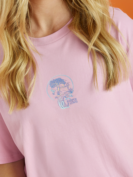 Front detail shot of the pink Aura tee, this shows the graphic which is the tree of life in blue, lavender and peach.