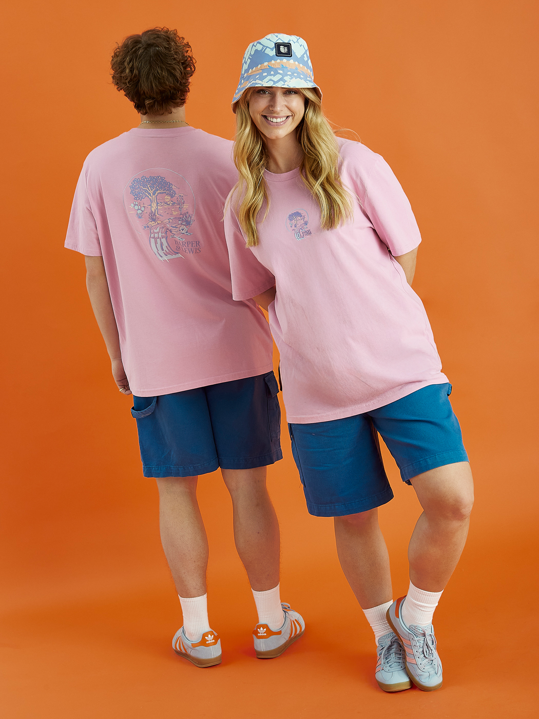 Two models showing the print the print of the Aura tee, this print features the tree of life.